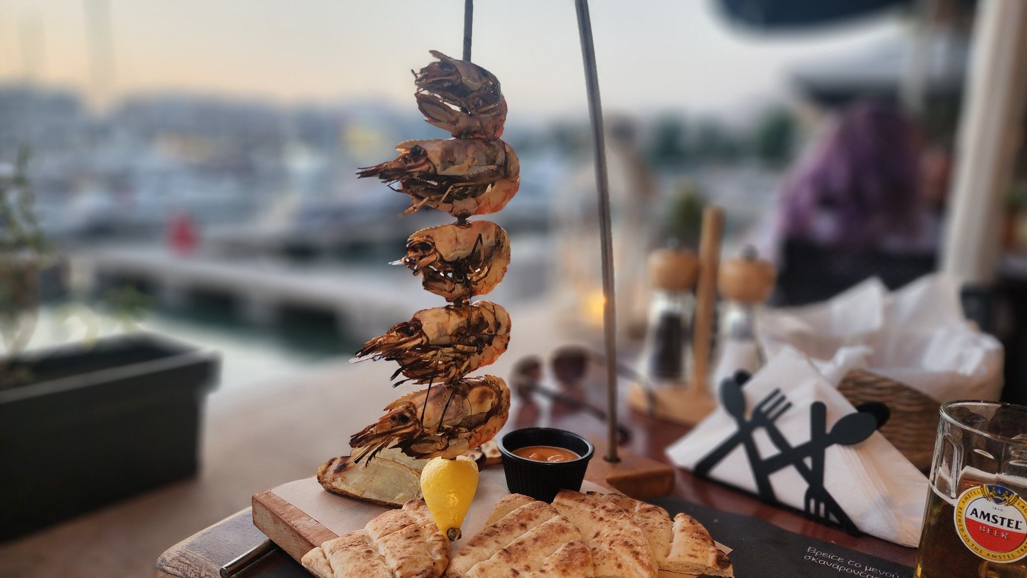 Grilled prawns by the marina in Greece