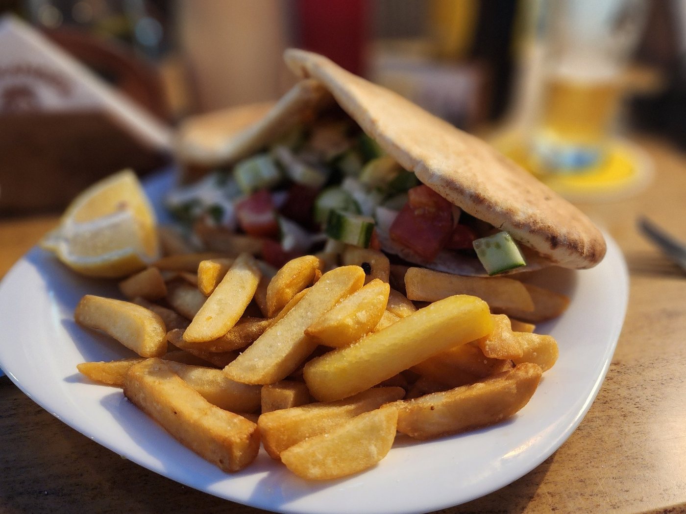 Souvlaki pita with chips on a plate